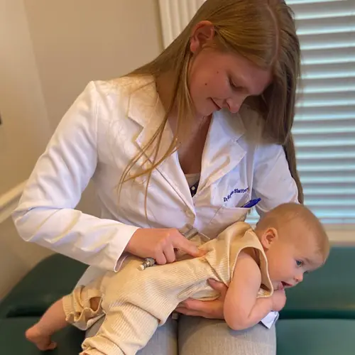 Chiropractor San Antonio TX McKenzie Slattery Checking Patient Spine